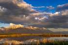 Wetlands pond reflects the Mission Mountains at sunset at Ninepipe NWR near Ronan, Montana, USA. Art Print